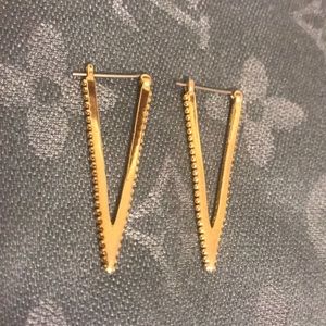 Rebecca Minkoff gold V earrings.